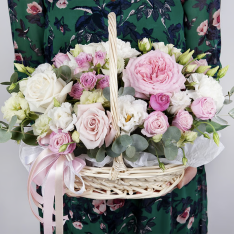 Basket with flowers in gentle colors photo