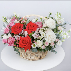 Basket with flowers in bright colors photo